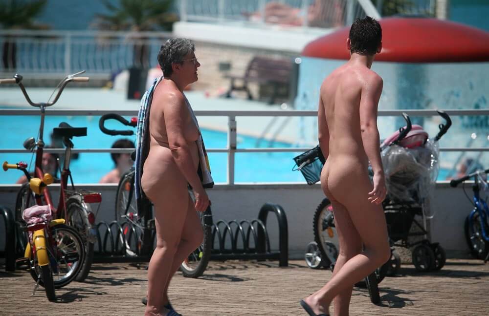 Sun-Soaked Sidewalk pics - The practice of nudity within a community