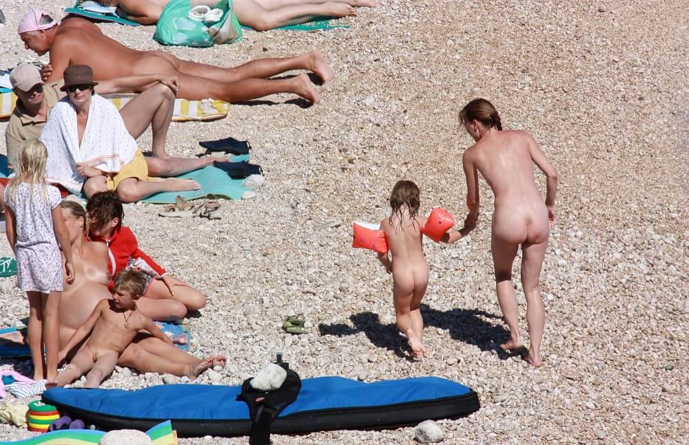 Orange Floaty Safety First Naturist pics - Lightheartedness and ease are characteristic features of the practice of nudism and naturism